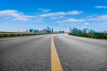 Foreground highway asphalt pavement city building commercial building office building