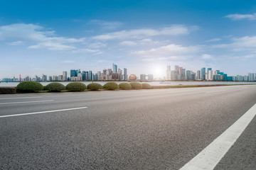 Foreground highway asphalt pavement city building commercial building office building