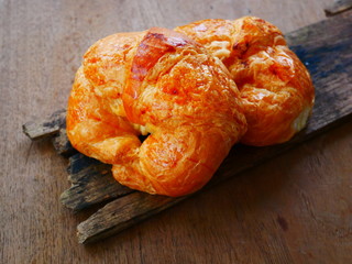 homemade croissants on wooden background
