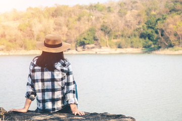 Women tourists in the midst of peaceful nature, Traveling of tourists only to find the beauty of nature.