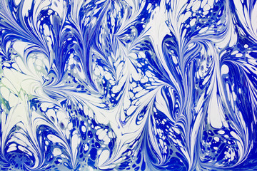 Beautiful abstract painting techniques drawing Ebru .Turkish style of painting Ebru on water with acrylic paints twists the waves.A stylish combination of natural luxury.Contemporary art of marming