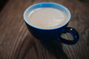 Mug of coffee on table