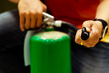 Man using  fire extinguisher.