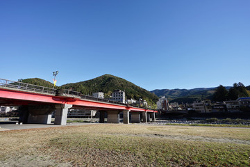Gero Bridge across the Hida River in Gero Onsen, the famous onsen city in Gifu Prefecture, Japan.