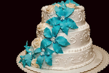 white wedding cake on a black background