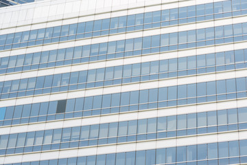 Modern office building with  blue glass windows