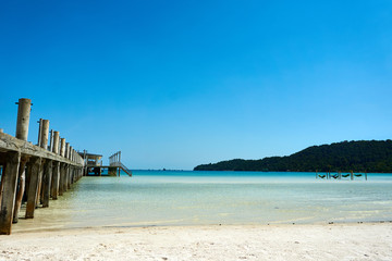 Pier at beach at nice sunny summer day. Koh Rong Sanloem island, Saracen Bay. Cambodia, Asia