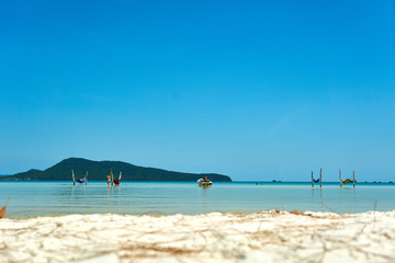 Girls in hammock in the beach at nice sunny summer day. Koh Rong Sanloem island, Saracen Bay. Cambodia, Asia