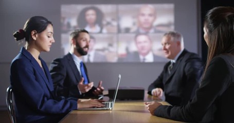 4K Fed up young businesswoman looking at camera, very bored in a meeting. Slow motion.