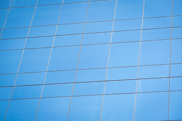 Fototapeta premium Modern office building with blue glass windows