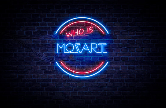 A red and blue neon sign on a brick wall that reads: Who is Mozart