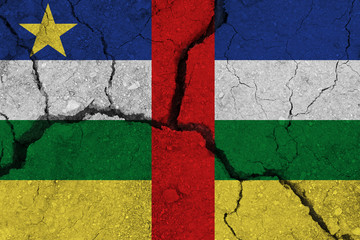 Central African Republic flag on the cracked earth