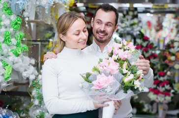 Loving couple deciding on flower decoration