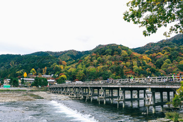 Beautiful Togetsukyo bridge in Arashiyama Kyoto Japan in autumn season .