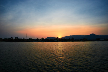Fototapeta premium Peaceful Sunset over mountain in Kampot Cambodia