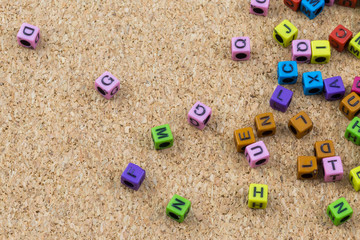 Colorful English alphabet on cork board