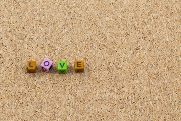 Fototapeta na wymiar Letters love on cork board
