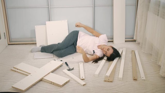 Woman lies on a parts of furniture