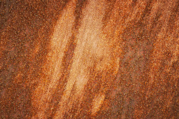 Background from rusty surface. Rust covers the surface unevenly and forms a pattern.