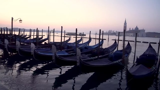 Gondolas in Venice in the moning. On background San Giorgio Maggiore island is visible