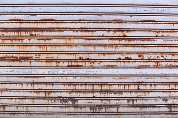 old detailed aged vintage rusty textured zinc alloy metal roller shutter door, store front exterior...