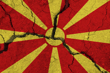 Fototapeta premium Macedonia flag on the cracked earth