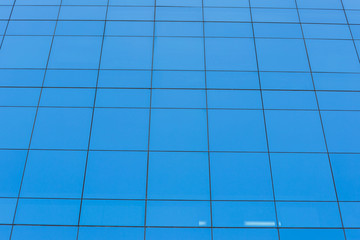 Modern office building with  blue glass windows