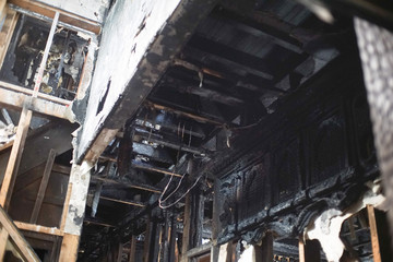 Burned interiors and furniture in home or office building. Fire consequences concept. - Image
