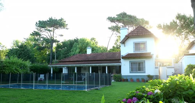 Suburban home house exterior backyard with lens-flare sunlight