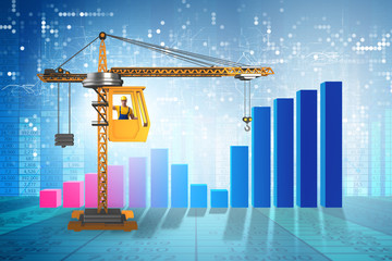 Crane operator in economic growth concept