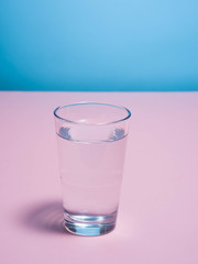 red tulip in a glass of water