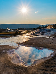 Reflection of the sun in the hot springs