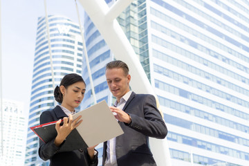 Two coworkers discussing project, business people consulting for work business on business...
