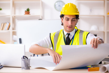 Male construction engineer working in the office 