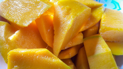 The yellow color of the ripe mango is delicious