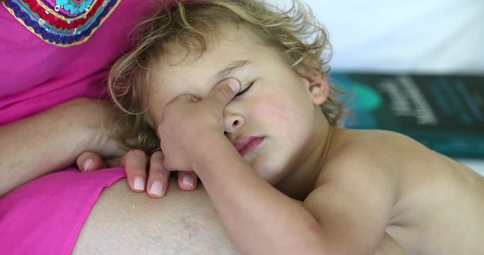 Tired little boy, bashful and shy, wanting to sleep