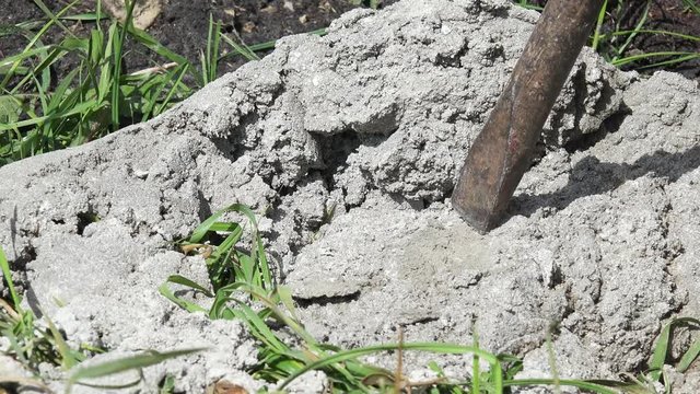 Chisel Breaking Concrete Block On Construction Site