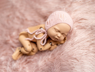 Mannequin of newborn for photo posing