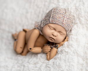 Mannequin of newborn for photo posing