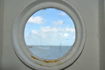 View through window of chain ferry across Poole harbour near Sandbanks, Dorset