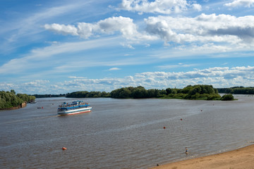 Fototapeta na wymiar VELIKY NOVGOROD, RUSSIA - AUGUST 14, 2018: The Volkhov River in Velikiy Novgorod. On the river floats ship. Russia, Velikiy Novgorod.