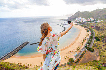 Traveler girl enjoying the beach in Tenerife
