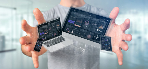 Businessman holding Devices connected to a cloud multimedia network 3d rendering