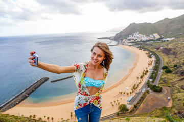 Traveler girl enjoying the beach in Tenerife