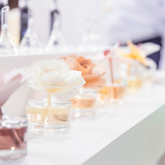 Clean, hygiene, aromatherapy, spa and health. Aromatic air freshener air freshener in glass jars in the form of rose flower for home and premises with different odors and aroma