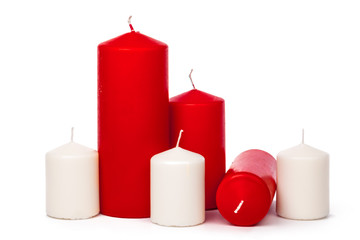 Red and white colored xmas candles isolated on white background