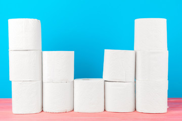 Toilet paper stack on bright blue background