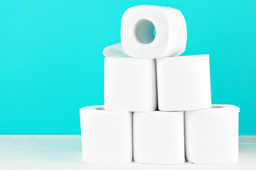 Toilet paper rolls on turquoise bright background