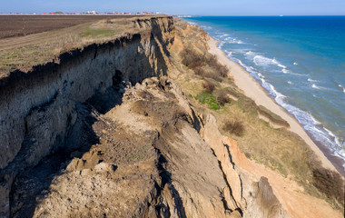 Mountain landslide in an environmentally hazardous area. Large crack in ground, descent of large...