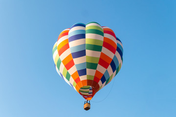 Fototapeta premium Hot air balloons flying in blue sky